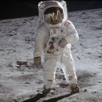 Astronaut Edwin Aldrin walks on lunar surface near leg of Lunar Module